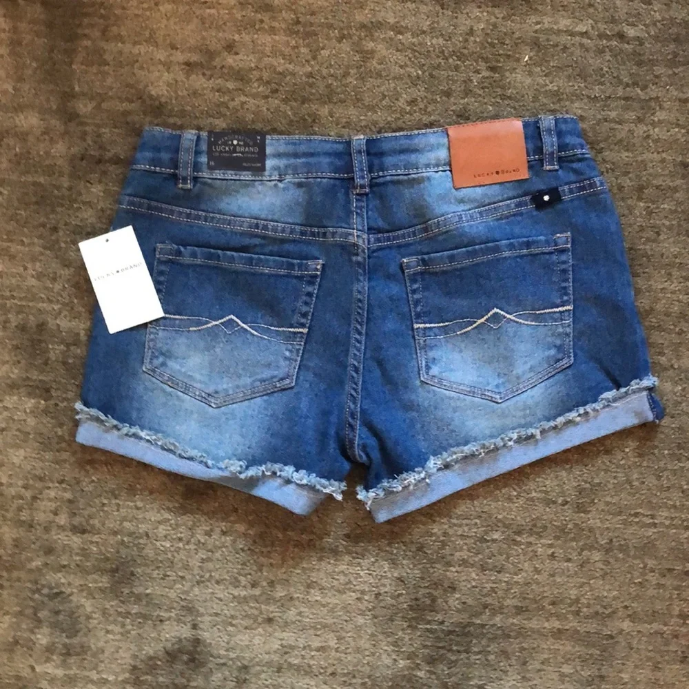Girl’s Lucky Brand frayed hemmed Riley ADA washed jean button shorts